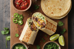 A colorful spread of homemade burrito ingredients ready for assembly