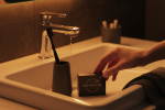 Dental floss container with string pulled out, symbolizing daily flossing habits in America.